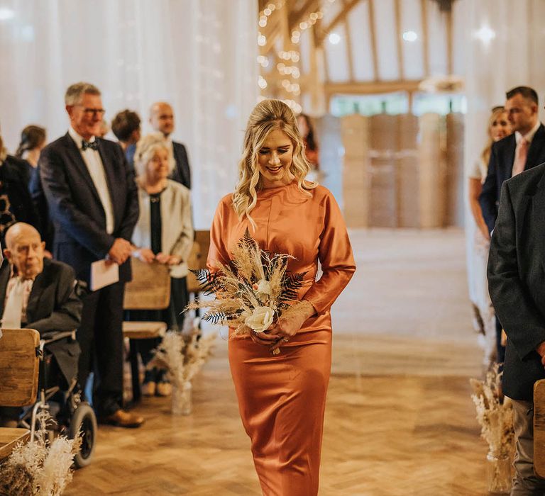 Burnt orange bridesmaid dress with pampas grass bouquet