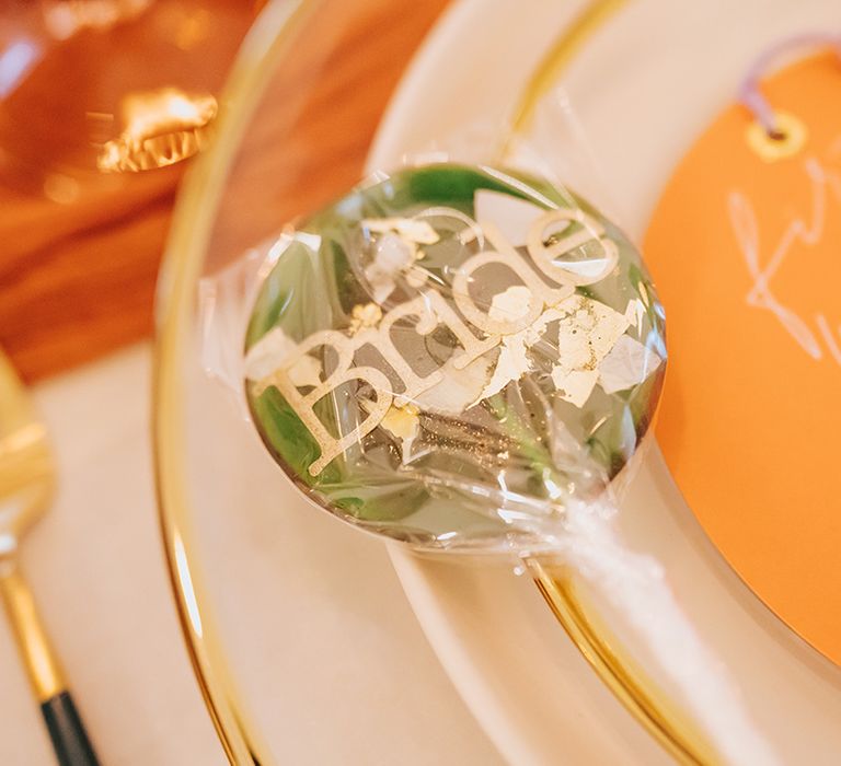 Green and gold speckled lollipop wedding favour 