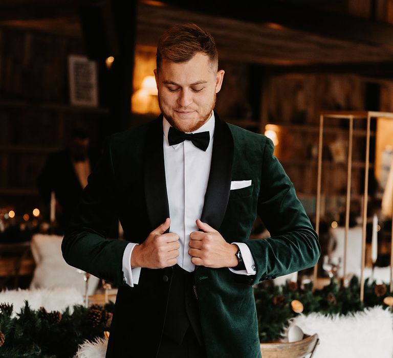 Groom in black tie for wedding including green velvet suit jacket