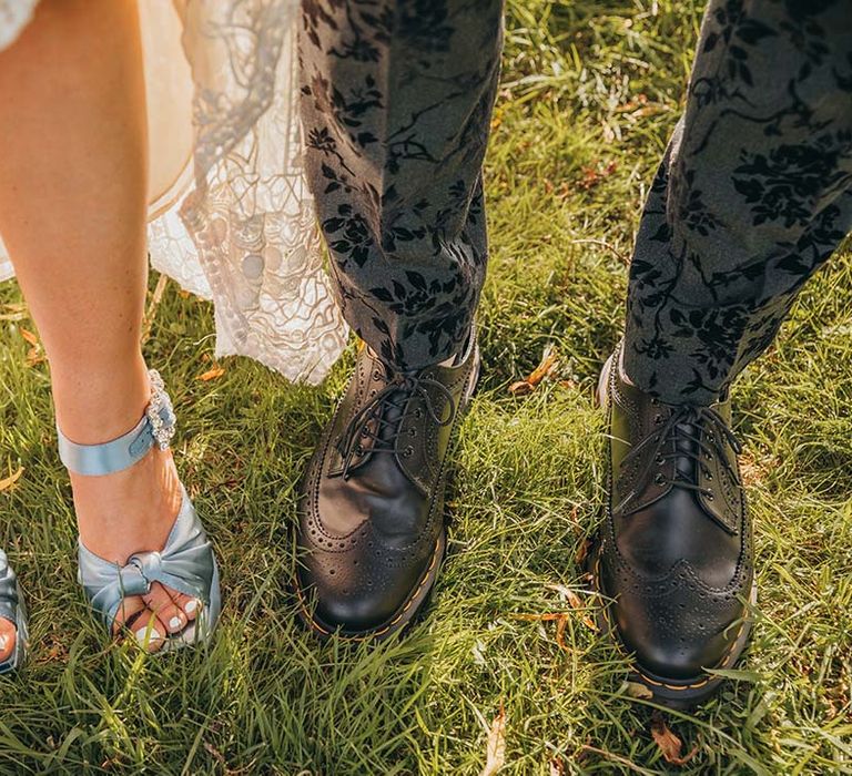 Blue wedding platform shoes with diamanté buckle by Jeffrey Campbell and groom in black brogues for wedding