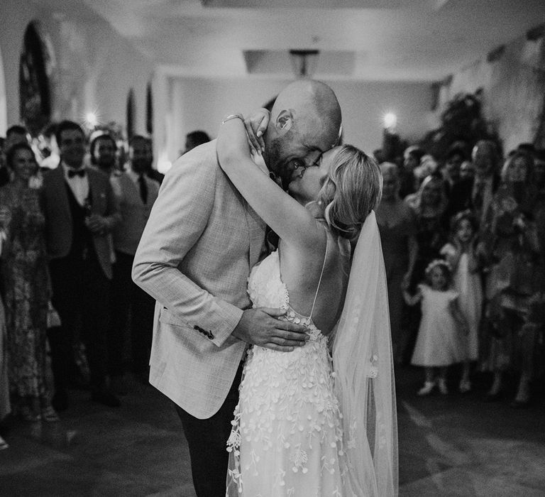 The bride and groom share their first dance together on their wedding day 