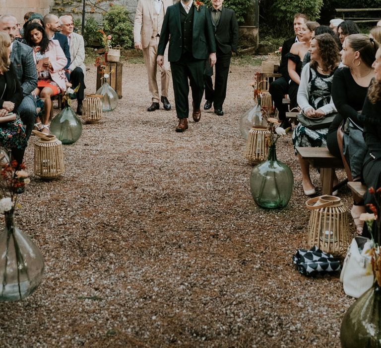 groom walking down the aisle at French castle wedding 