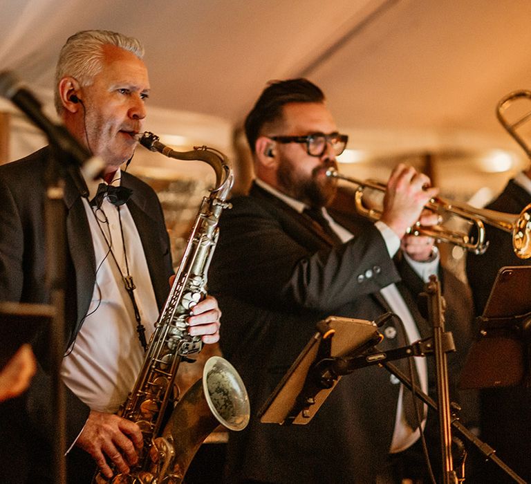 The wedding band perform at the wedding reception 