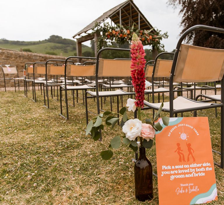 Hope Farm in Dorset wedding venue with orange seating signage directing guests where to sit 