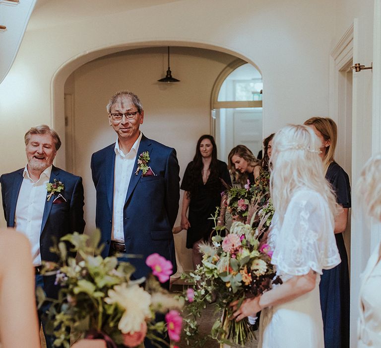 Two father of the brides in navy suits at their daughter's wedding 