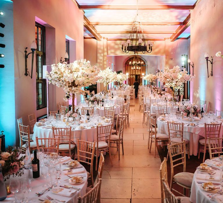 Ashridge House wedding breakfast with blossom tree table centrepieces 