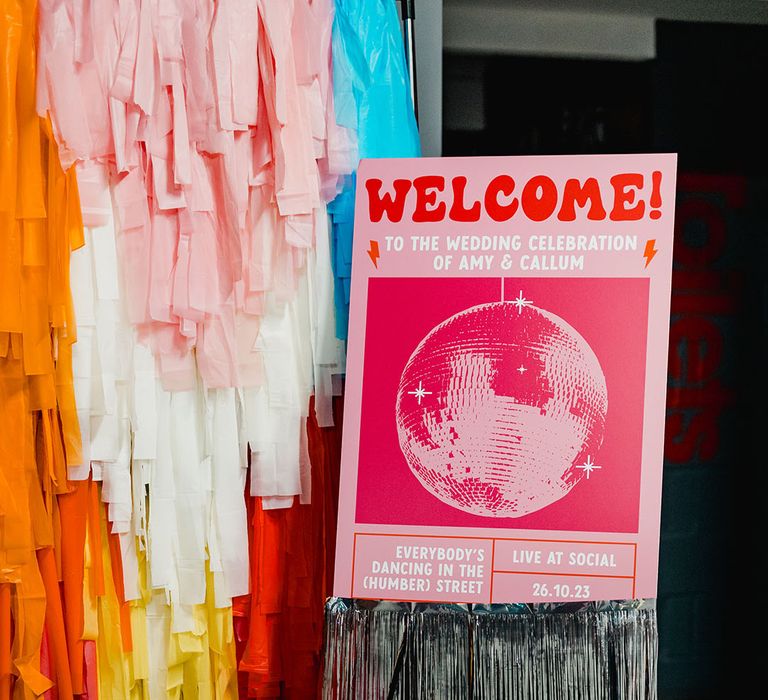 Pink disco ball wedding welcome signage for colourful wedding 