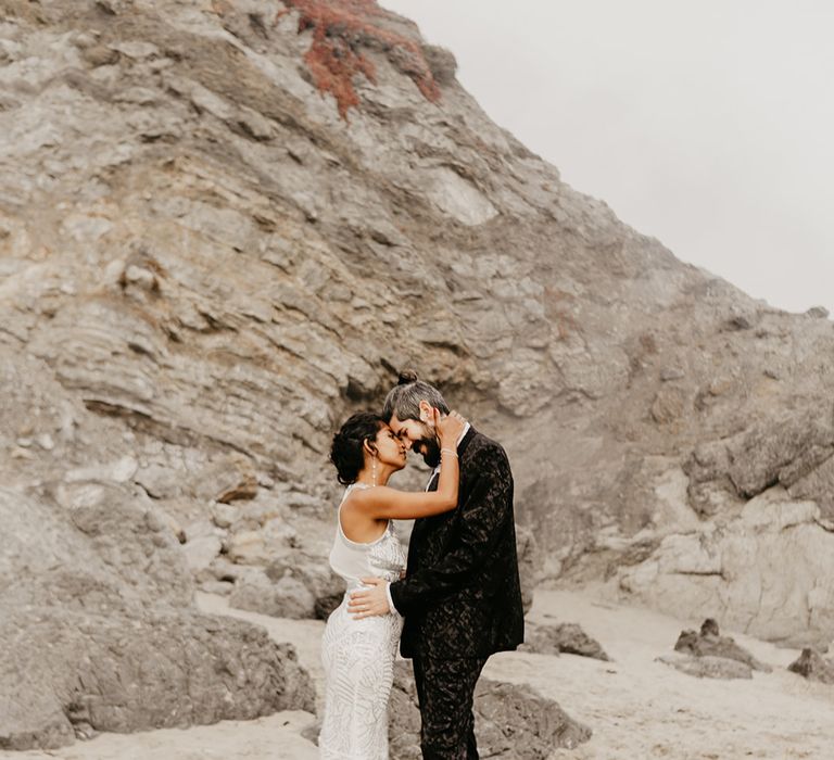 Beach portraits of a stylish bride and groom 