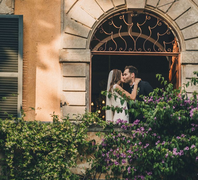 Stunning archway window newly wed photography at Italy wedding