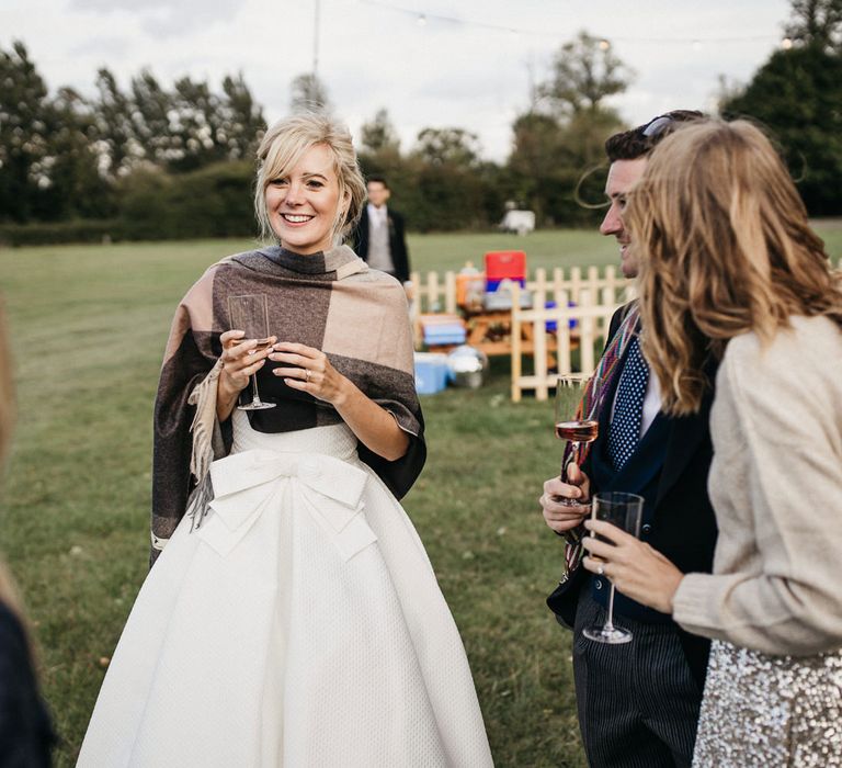 Bride in a wedding dress with bow waist detail and will wrap 