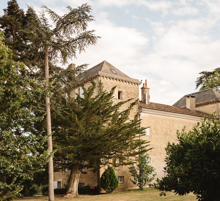 Long driveway leading up to a French chateau