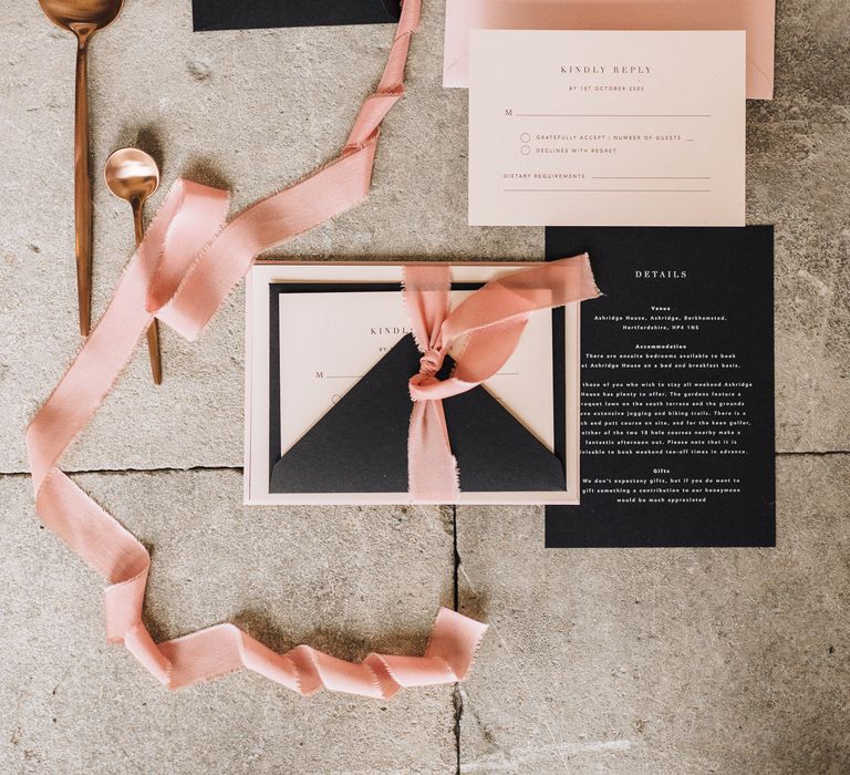 Black and light pink wedding stationery suite tied up with dusky pink natural linen ribbon 