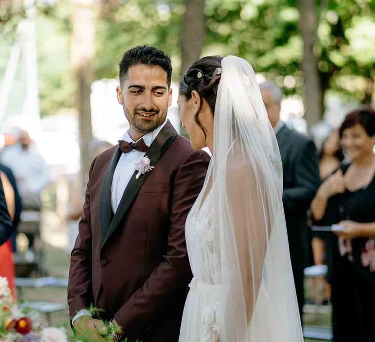 Bride and groom during outdoor wedding ceremony in Italy