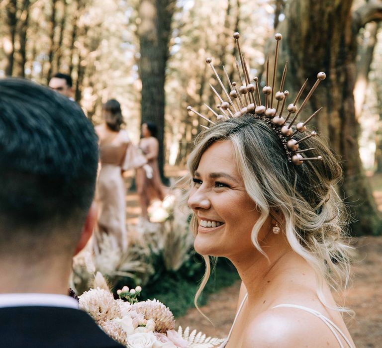 Metallic bridal crown for bride in tulle skirt wedding dress