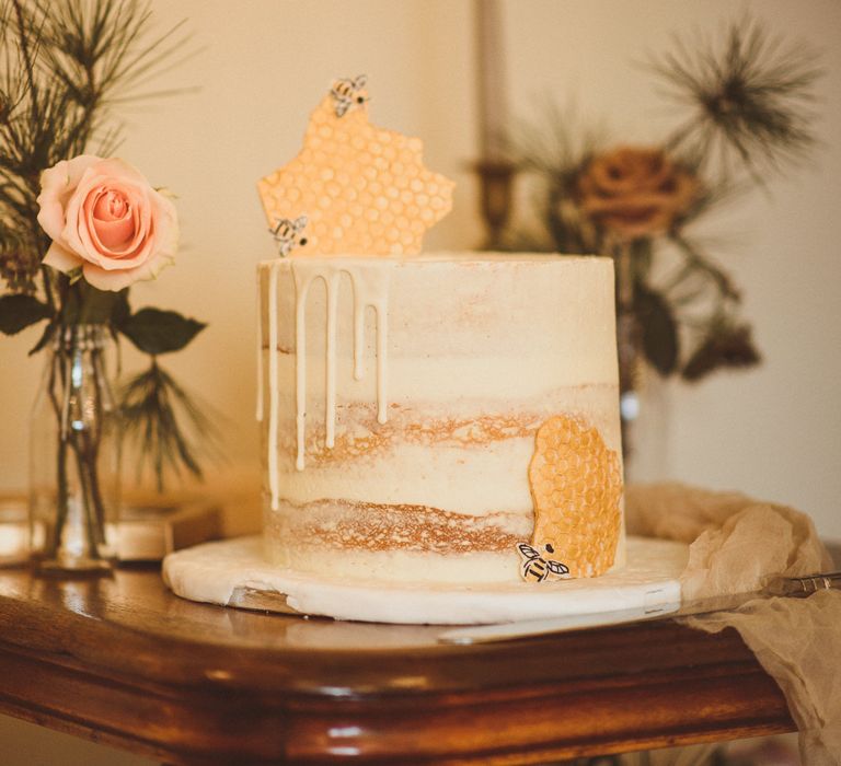 Single tier semi-naked wedding cake with waffles and bee design 