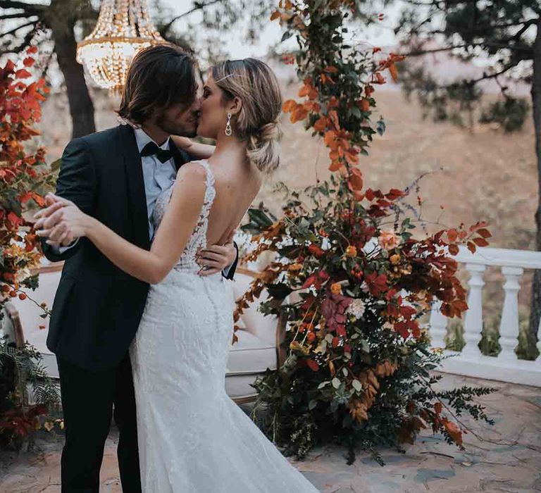 Bride in low back lace dress for intimate elopement in Marbella villa