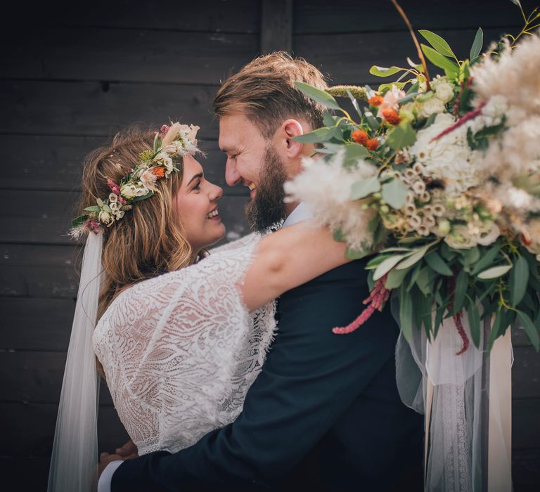 Bride & groom kiss on their wedding day