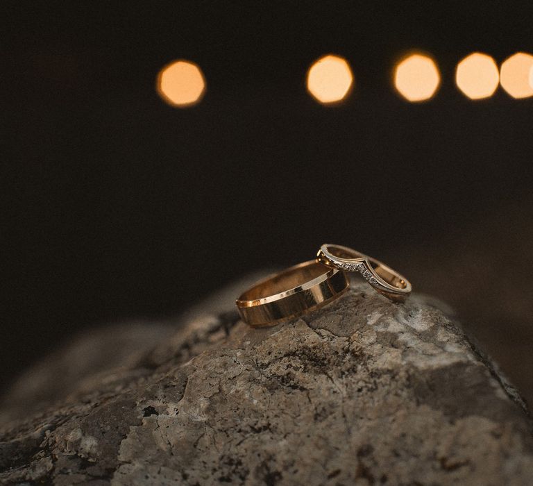 Wedding rings resting on stone at Inkersall Grange Farm wedding