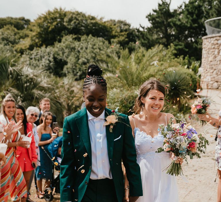 LGBTQI+ wedding with two brides in a green wedding suit and Grace Loves Lace wedding dress 