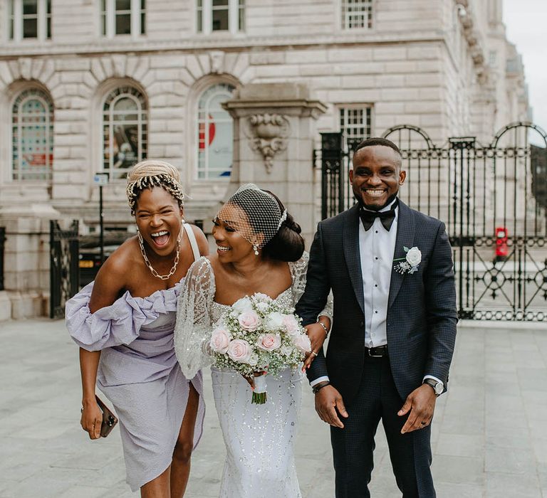 Bride & groom laugh on their wedding day 