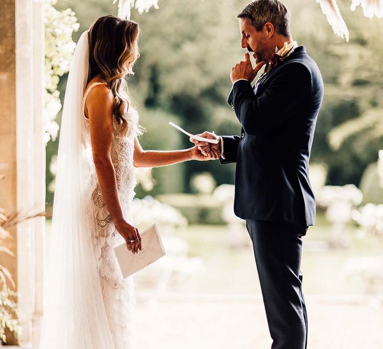 Bride & groom look lovingly at one another on the day of their wedding