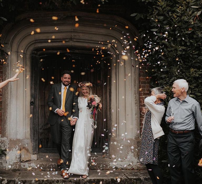 Confetti moment for bride and groom at Hellens Manor