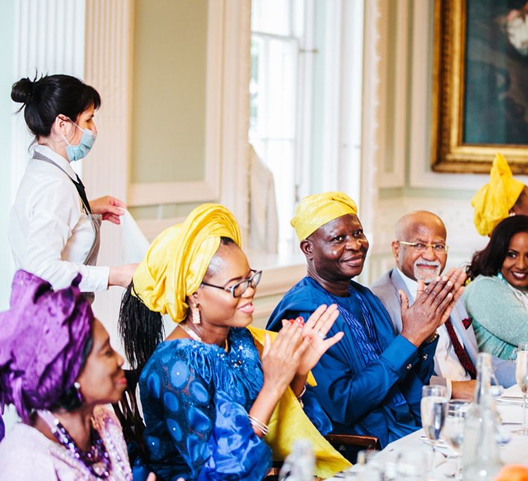 Wedding guests wear traditional African outfits on wedding day