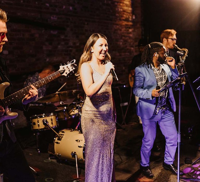 Live wedding band entertainment for wedding reception at rustic Cooling Castle Barn venue