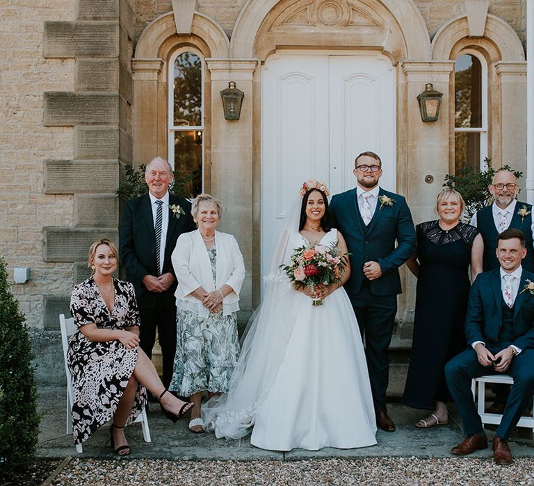 Bride and groom with their immediate family members outside St Tewdrics House 