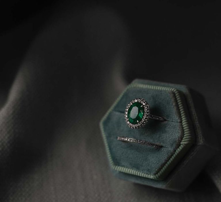 Emerald pave engagement ring with plain diamond wedding band in velvet ring box 