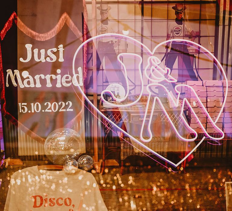 Neon wedding sign with personalised wedding t-shirt, disco balls, and wedding banner signage 