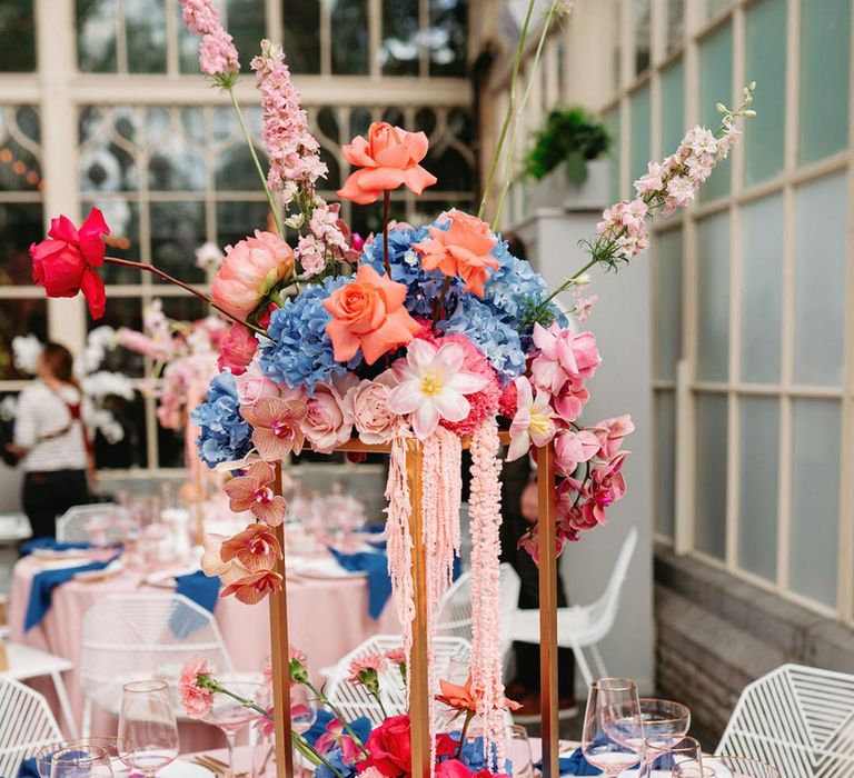 Botanical wedding table centrepieces with hydrangeas, roses, orchids, reflexed tulips and carnations 