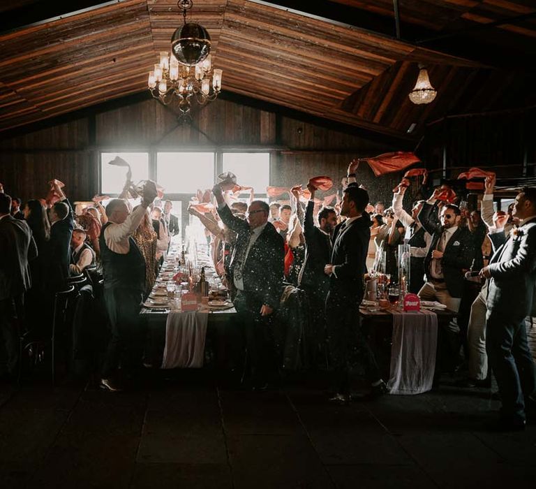 Willow Marsh Farm Loughborough wedding venue reception room with guests twirling napkins 