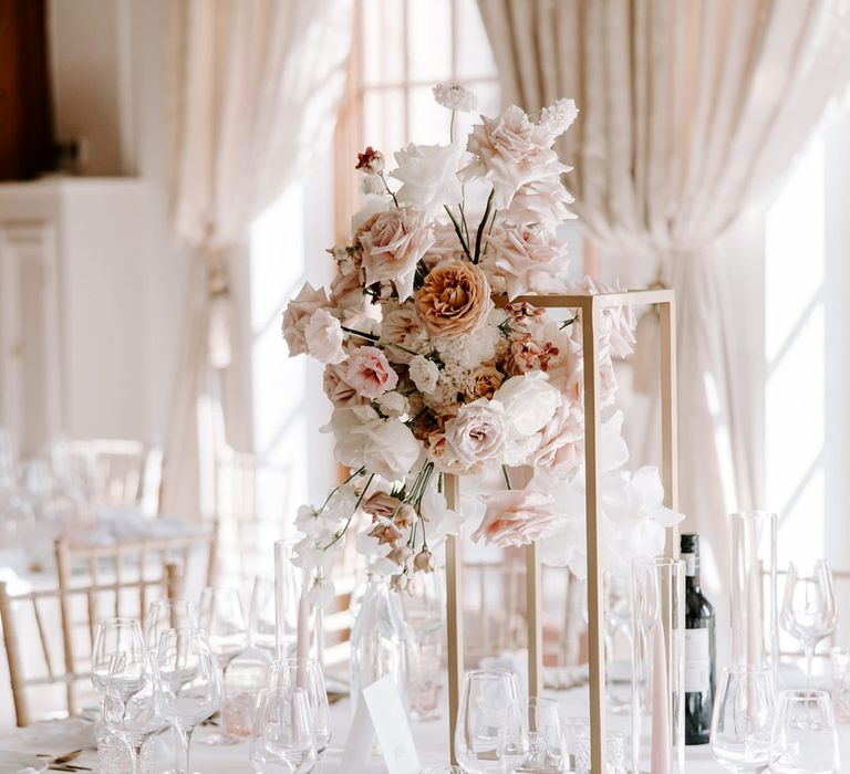 Roses in pink and white for tall wedding table centrepiece 