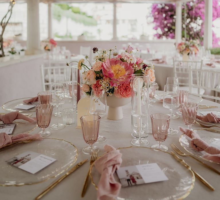 Wedding breakfast at Restaurant Park Hvar with blush tablescape decor, blush and pink peonies and fairy light wedding lighting