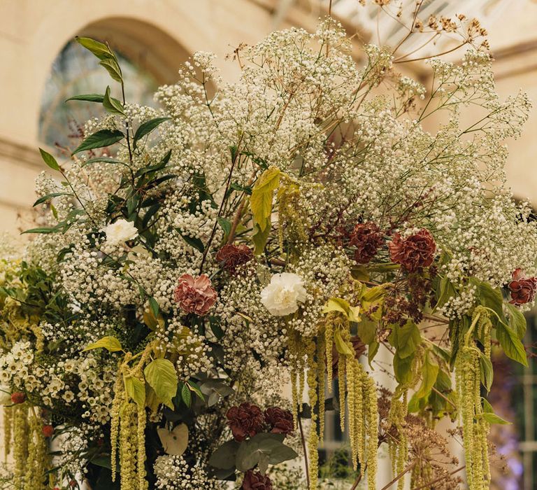 Natural wedding flower columns with hanging green amaranthus 