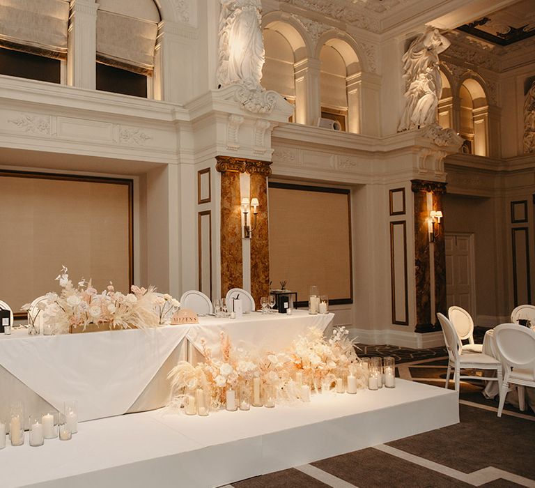 Wedding top table decorated for boho luxe wedding with pampas grass and blush pink and white colour scheme 