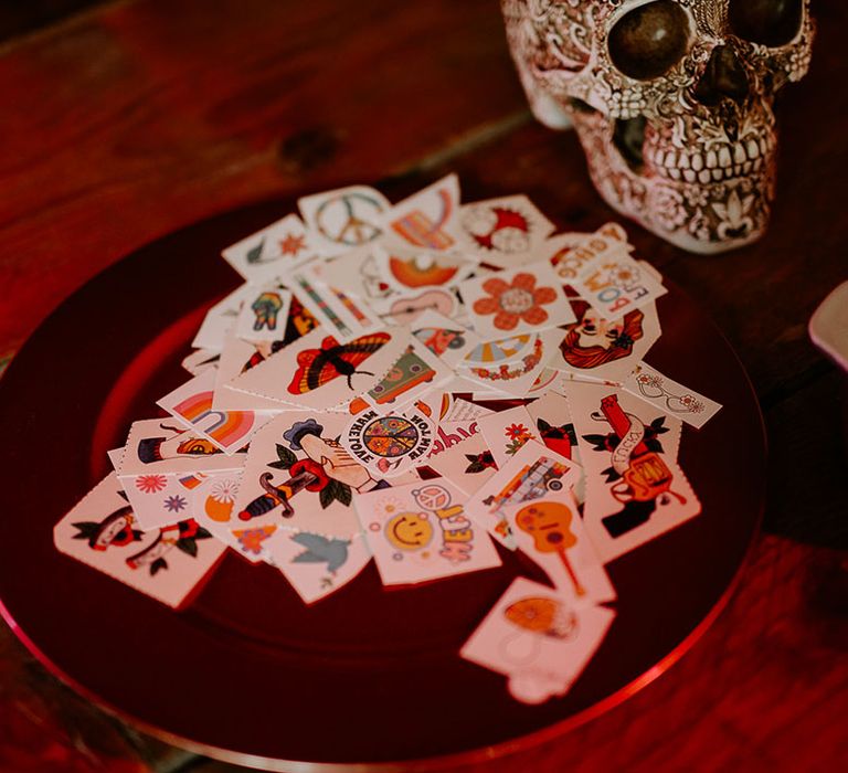 Temporary tattoo station as entertainment idea for guests with themed tattoos 