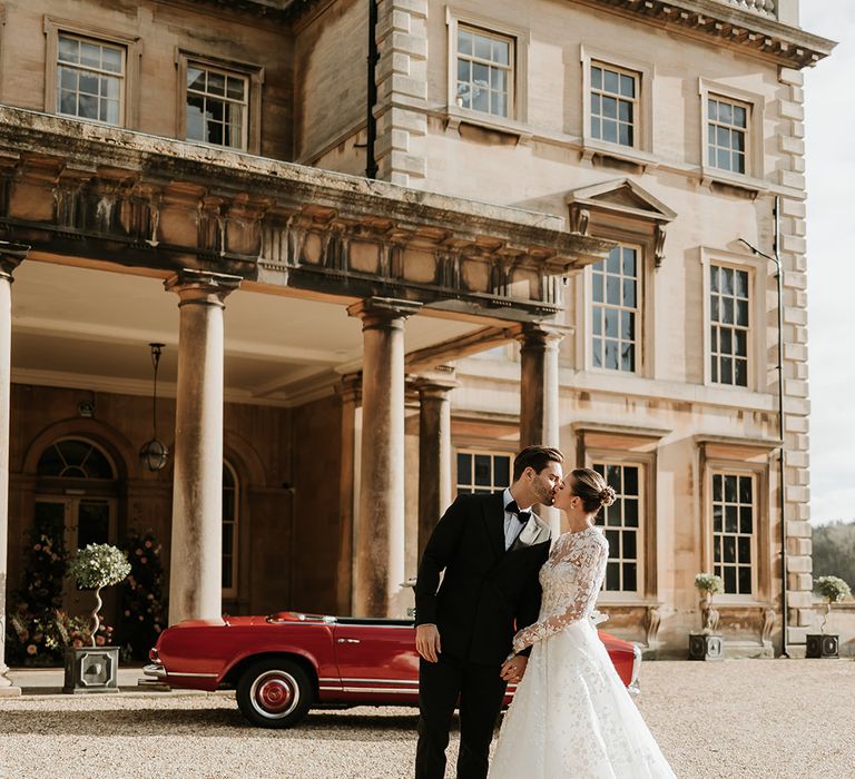 Bride and groom in black tie wedding fashion at Prestwold Hall Leicestershire wedding venue 