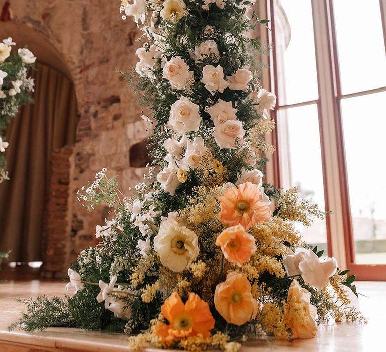 Stunning wedding flower column arrangement with yellow and white wedding flowers for luxe castle wedding 