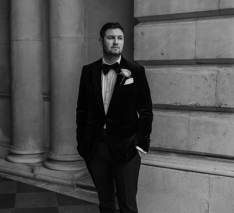 Groom in black tuxedo at the London city wedding and twilight ceremony 