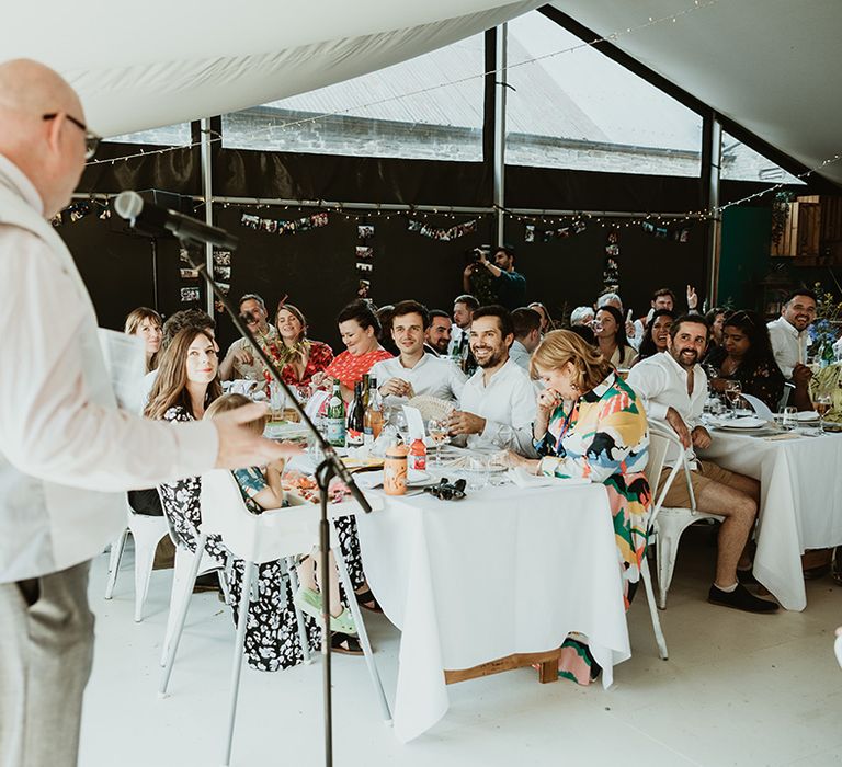 Father of the groom reads out wedding speech at the same sex wedding 