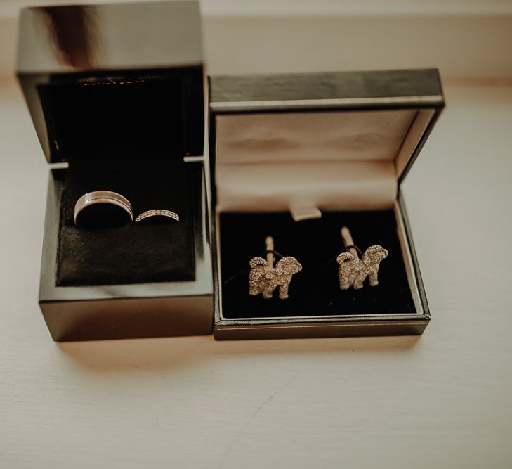 Wedding rings and dog themed cufflinks 