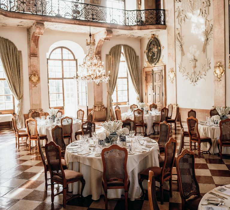 Intimate wedding reception with blue and white Chinese Pottery centrepieces 