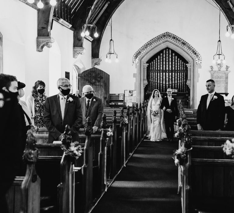 Bride walking down the aisle with father