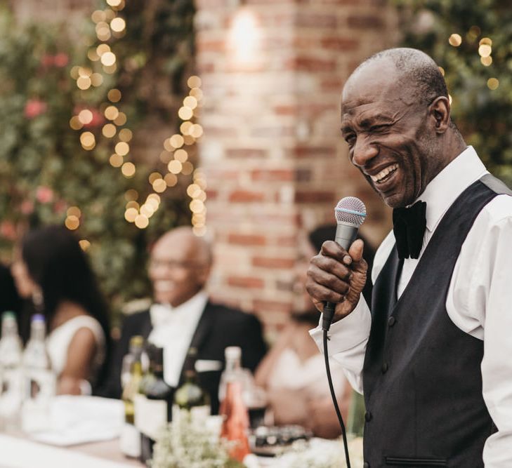 Father of the groom wedding speech in a black waistcoat and bow tie 