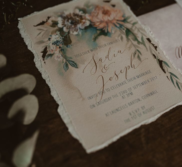 French wedding stationery for a Parisian elopement. With torn paper edges and calligraphy. Photography by Nesta Lloyd.