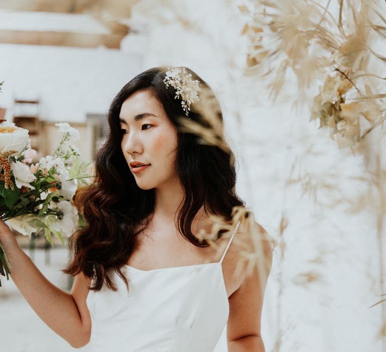 Simple and sophisticated white wedding dress for a minimal white and gold wedding