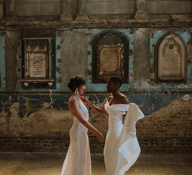 Two brides dancing in The Asylum wedding venue in Peckham, London