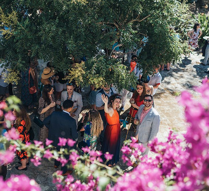 Wedding guests celebrate outdoors in Menorca